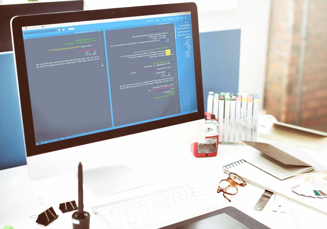 Professional web design workspace showcasing modern development tools and creative process