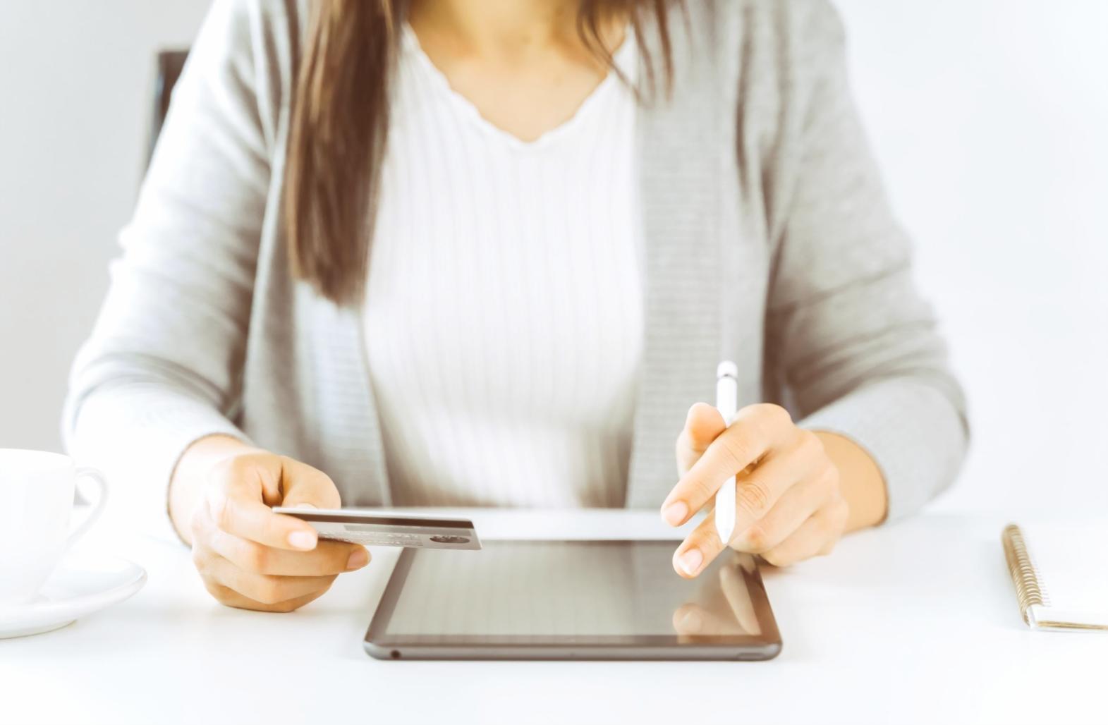 Close-up of designer sketching website wireframes on paper