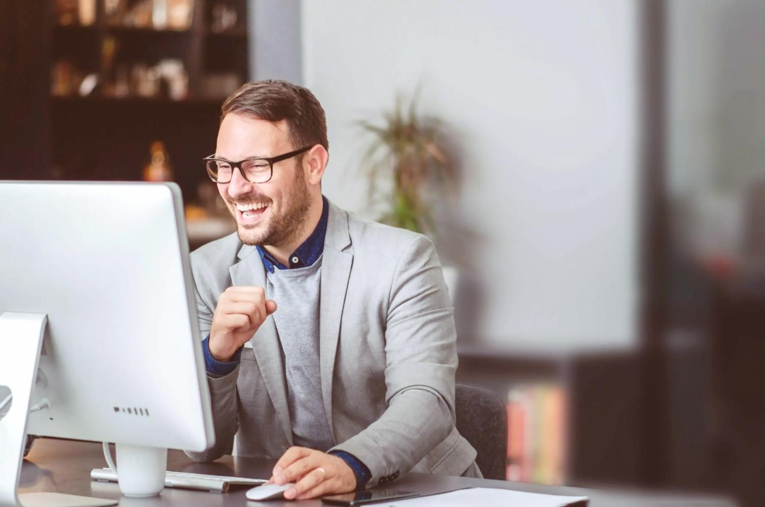 Developer reviewing code on laptop screen during evening work session